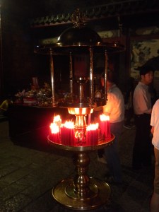 Worshipers Light Candles...