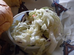 Slaw goes on top of the sandie...