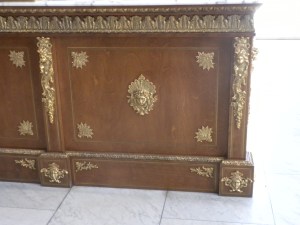 Elegant Carrera Marble Counters and Ornate Woodwork